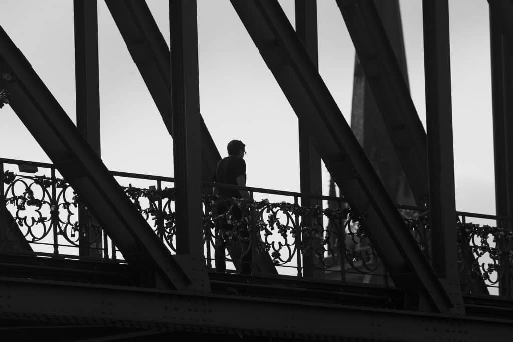 silhouette of man on bridge