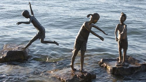 sculpture of children playing in water